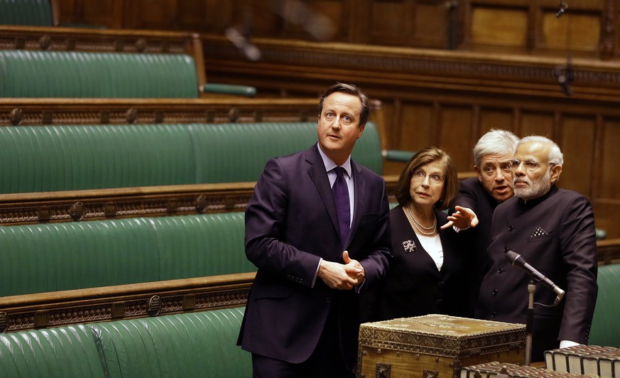 FILE - In this Thursday, Nov. 12, 2015 file photo, Britain&#039;s Prime Minister David Cameron, left, with India&#039;s Prime Minister Narendra Modi, right, John Bercow, the Speaker of the House of Co ...