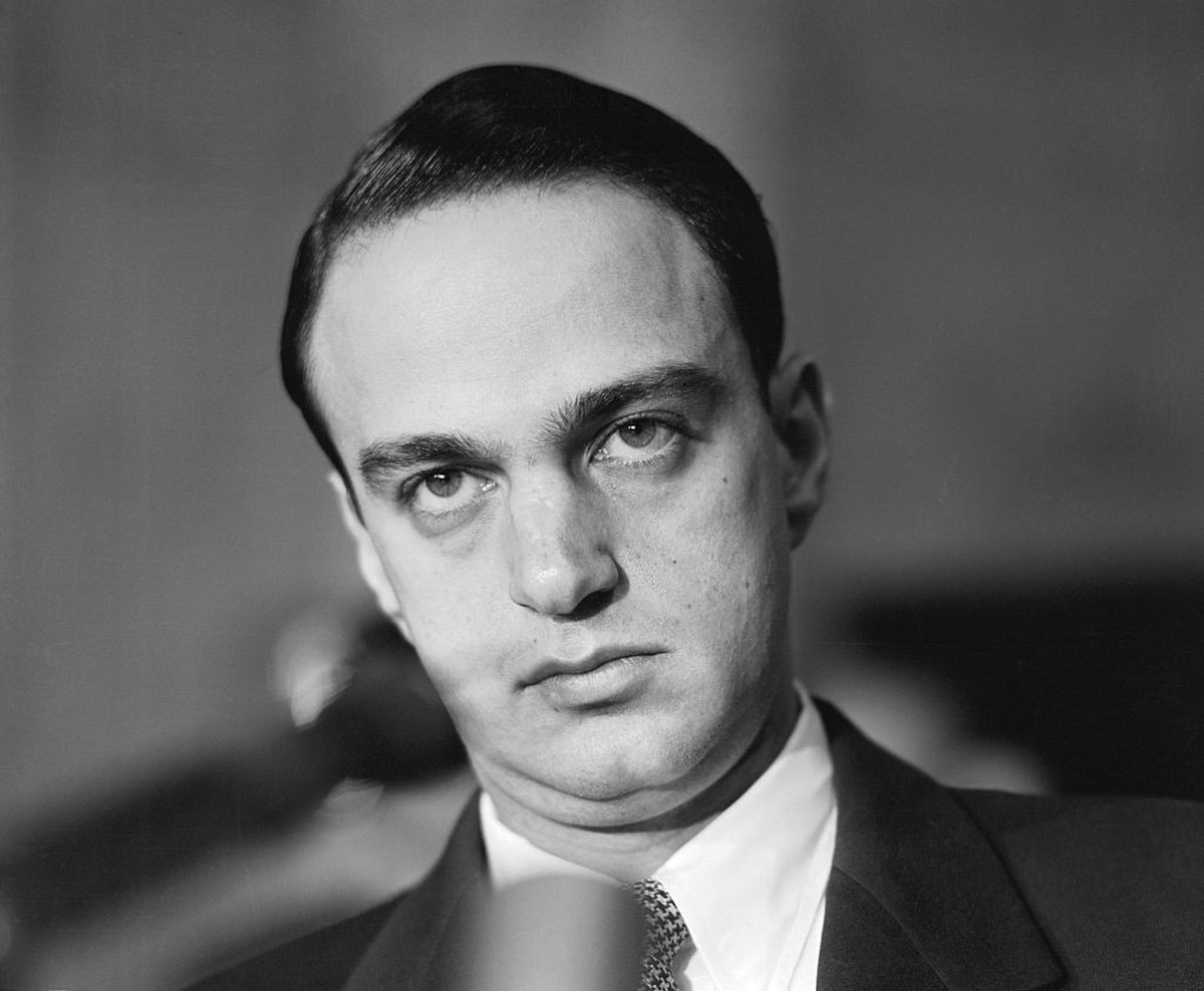 (Original Caption) Roy Cohn, counsel for the Senate Investigating Subcommittee wears a grim expression as he listens to testimony from Army Counselor John Adams at the McCarthy-Army Hearings on May 12 ...