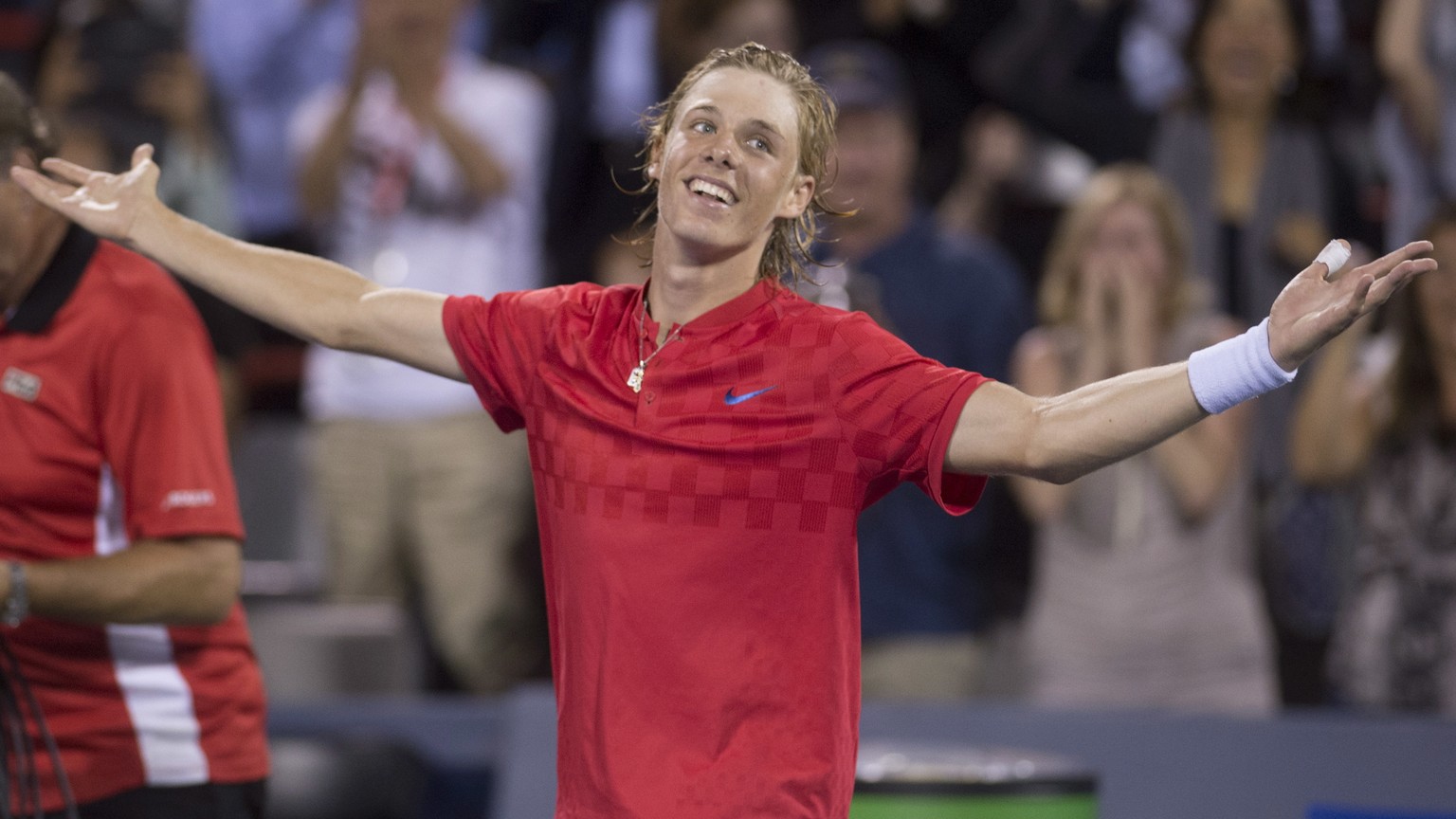 Denis Shapovalov, of Canada, salutes the crowd after defeating Rafael Nadal, of Spain, 3-6, 6-4, 7-6 (4) at the Rogers Cup tennis tournament Thursday, Aug. 10, 2017, in Montreal. (Paul Chiasson/The Ca ...