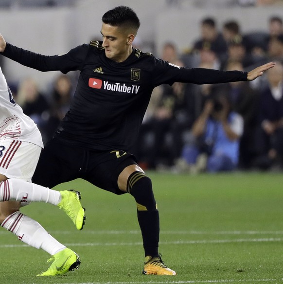 Real Salt Lake&#039;s Sebastian Saucedo, left, is defended by Los Angeles FC&#039;s Eduard Atuesta during the first half of an MLS soccer match Saturday, March 23, 2019, in Los Angeles. (AP Photo/Marc ...