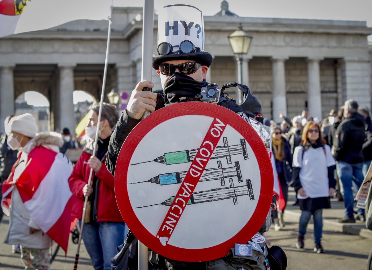 FILE - A man takes part in a demonstration against the country's coronavirus restrictions in Vienna, Austria, Nov. 20, 2021. Austria's parliament is due to vote Thursday, Jan. 20, 2022, on p ...