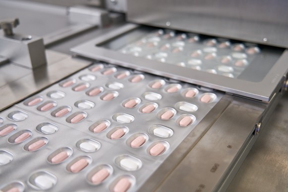 epa09643289 An undated handout photo made available by Pfizer Inc. shows Paxlovid, a Pfizer&#039;s coronavirus disease (COVID-19) pill, being manufactured in Acoli, Italy (issued 15 December 2021). US ...