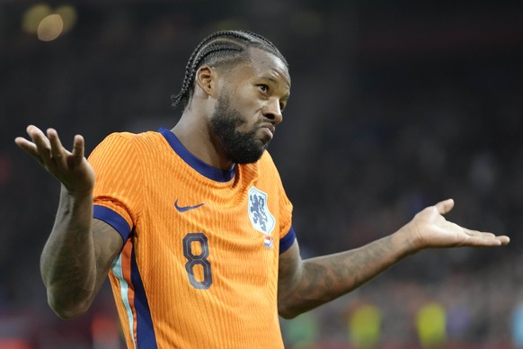 Netherlands&#039; Georginio Wijnaldum celebrates after scoring his side&#039;s second goal during an international friendly soccer match between Netherlands and Scotland at the Johan Cruyff ArenA, in  ...