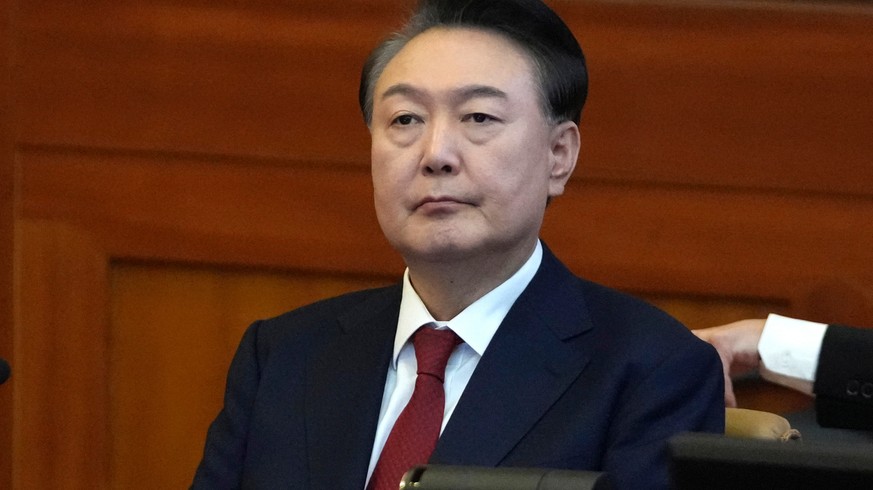 FILE - South Korea's impeached President Yoon Suk Yeol attends a hearing of his impeachment trial at the Constitutional Court in Seoul, South Korea, on Feb. 11, 2025. (AP Photo/Lee Jin-man, Pool, ...