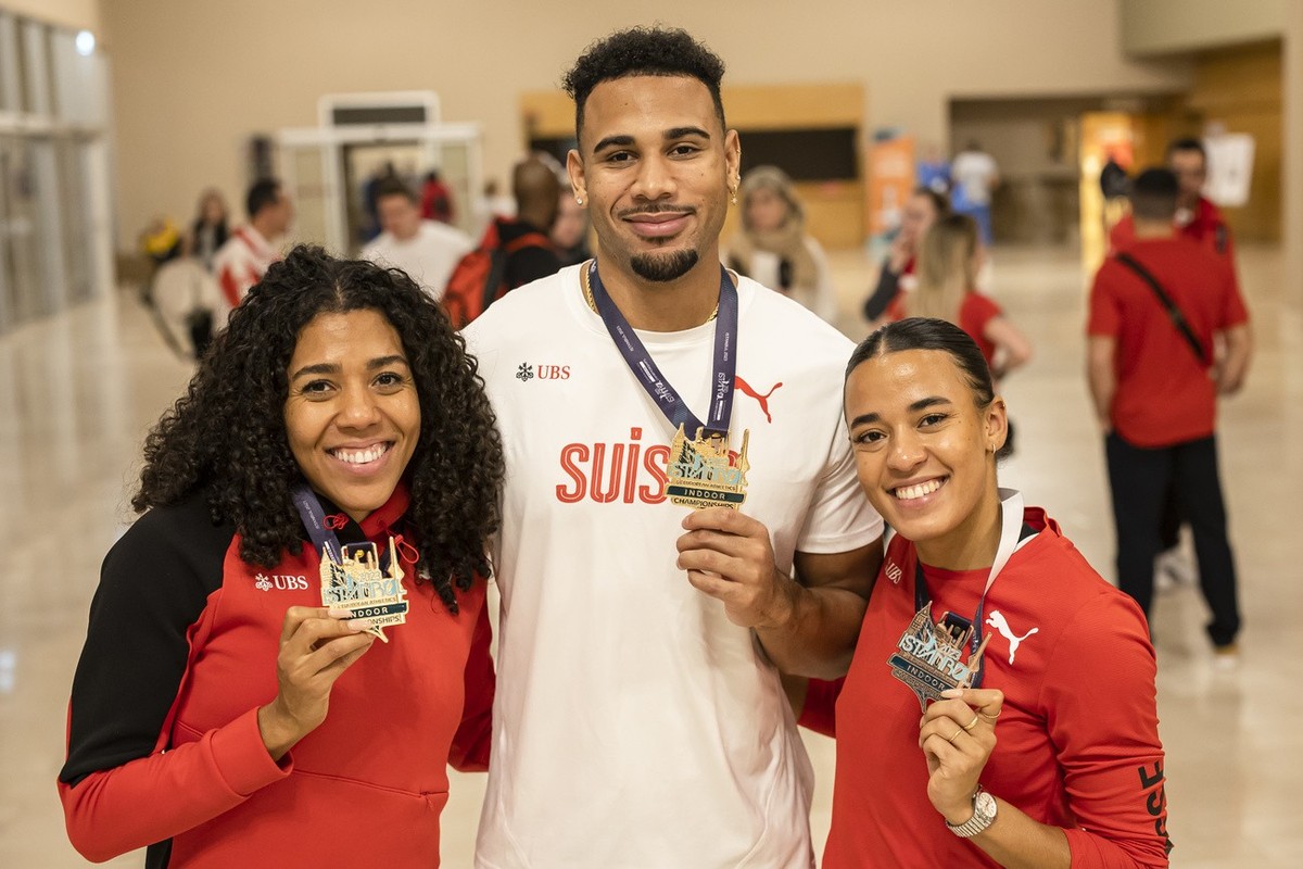 Gold medal winner Mujinga Kambundji of Switzerland, Gold medal winner Jason Joseph of Switzerland and Bronze medal winner Ditaji Kambundji of Switzerland, left to right, pose at the Team Hotel after t ...