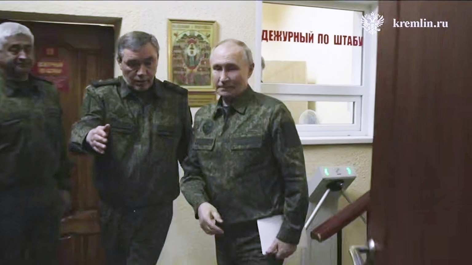 In this image made from video released by the Russian Presidential Press Service, on Wednesday, March 12, 2025, Russian President Vladimir Putin, right, accompanied by Russian Chief of General Staff G ...
