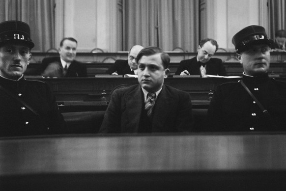 This image of December 10, 1936, shows Jewish student David Frankfurter (middle) in the dock during his trial in Chur in the canton of Grisons, Switzerland. David Frankfurter shot down Nazi official W ...