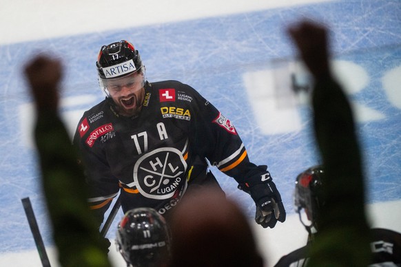 Lugano&#039;s player Luca Fazzini celebrates the 2 - 2 goal during the preliminary round game of National League Swiss Championship 2023/24 between HC Lugano against HC Ambri Piotta at the Corne�r Are ...