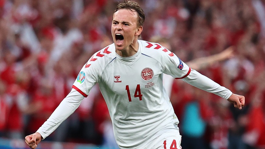 epa09291822 Mikkel Damsgaard of Denmark celebrates after scoring the 0-1 goal during the UEFA EURO 2020 group B preliminary round soccer match between Russia and Denmark in Copenhagen, Denmark, 21 Jun ...