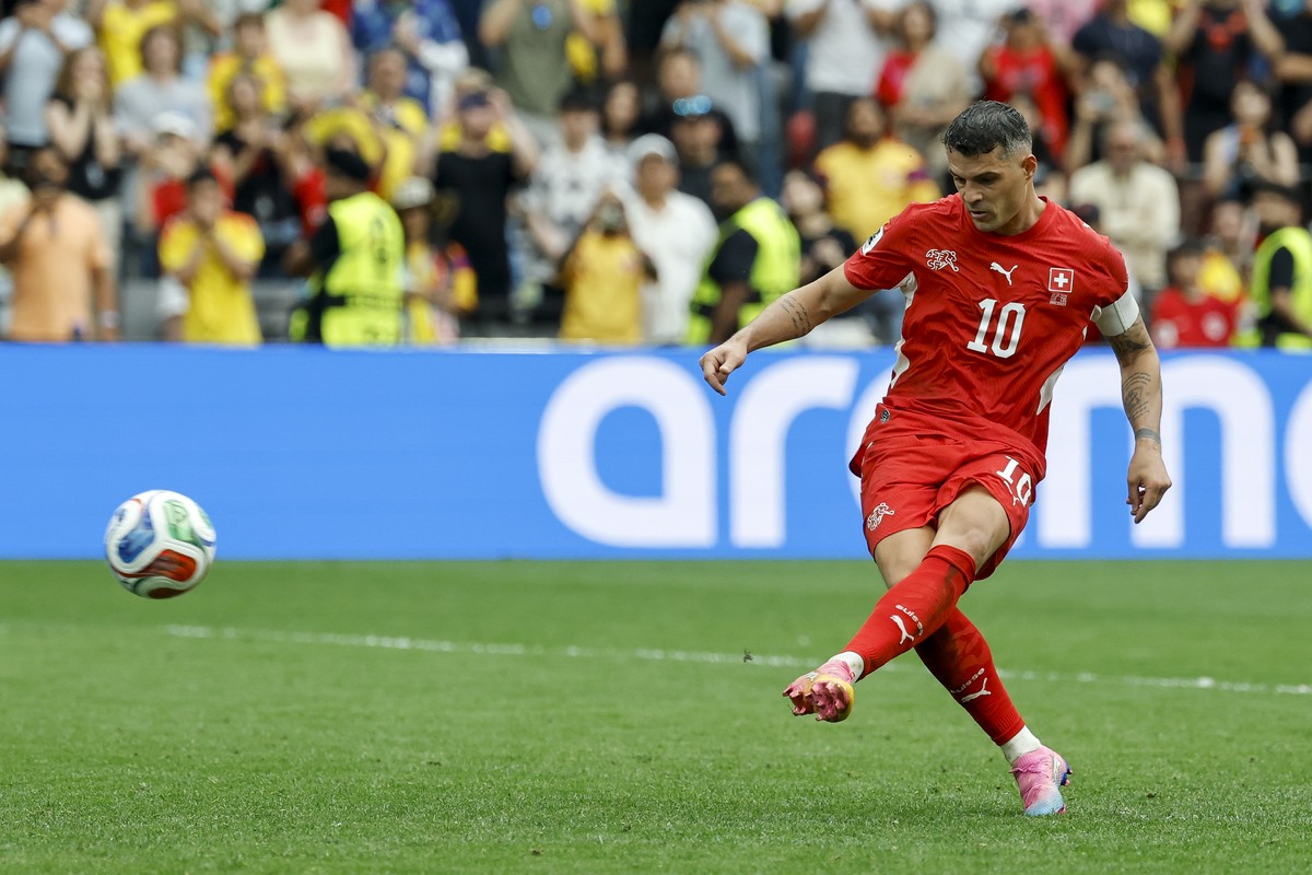 Switzerland's Granit Xhaka scores his penalty during the World Cup round of 16 soccer match between Switzerland and Colombia at the BC Place stadium in Vancouver, Canada, Tuesday, July 7, 2026, d ...