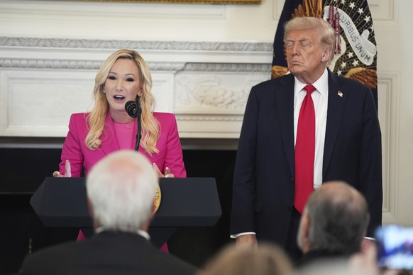 Pastor Paula White speaks as President Donald Trump listens during the White House Faith Office luncheon in the State Dining Room, Monday, July 14, 2025, in Washington. (AP Photo/Evan Vucci)
Donald Tr ...
