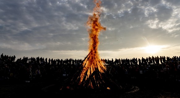 epa07538685 People gather around a May bonfire celebrating Walpurgis Night in Malmo, southern Sweden, 30 April 2019. Walpurgis Night in Sweden is a traditional religious holiday of pre-Christian origi ...