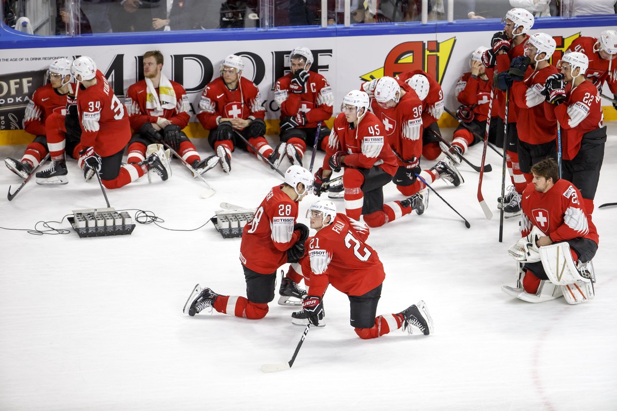 Switzerland's players look disappointed after losing against team Sweden, during the shootout of the IIHF 2018 World Championship Gold Medal game between Sweden and Switzerland, at the Royal Aren ...