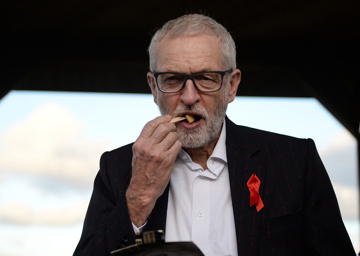 epa08037461 Britain's opposition Labour Party leader Jeremy Corbyn eats chips during a general election campaign event in Whitby, Britain, 01 December 2019. Britons go to the polls on 12 December ...