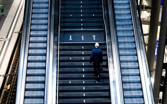 epa10977755 A passenger walks on stairs on empty platform during the German Train Drivers&#039; Union (GDL) strike at Berlin Central Railway Station in Berlin, Germany, 16 November 2023. German unions ...