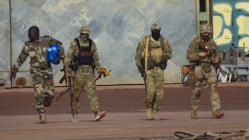 FILE - This undated photograph provided by the French military shows three Russian mercenaries, in northern Mali. The Russian mercenary group that briefly rebelled against President Vladimir Putin?s a ...