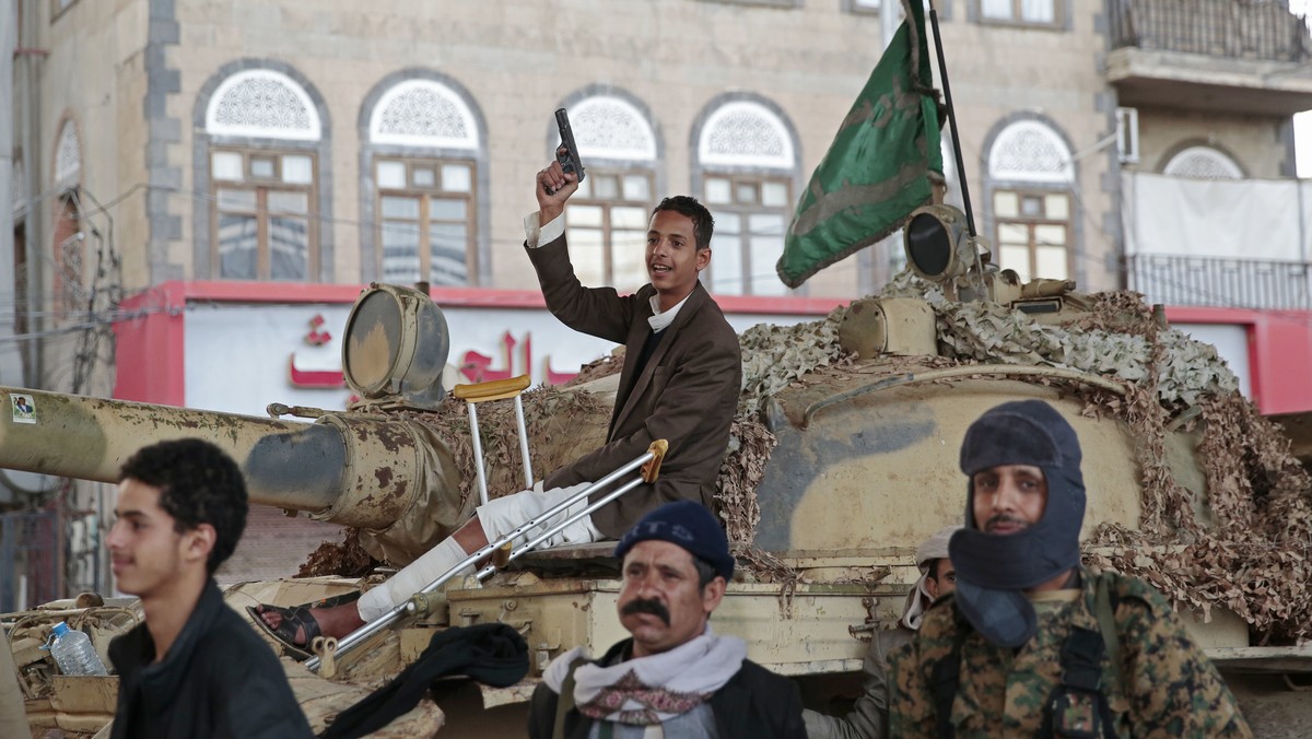 FILE - In this Dec. 4, 2017, file photo, Houthi Shiite fighters guard a street leading to the residence of former Yemeni President Ali Abdullah Saleh, in Sanaa, Yemen. A senior leader from Yemen’s Hou ...