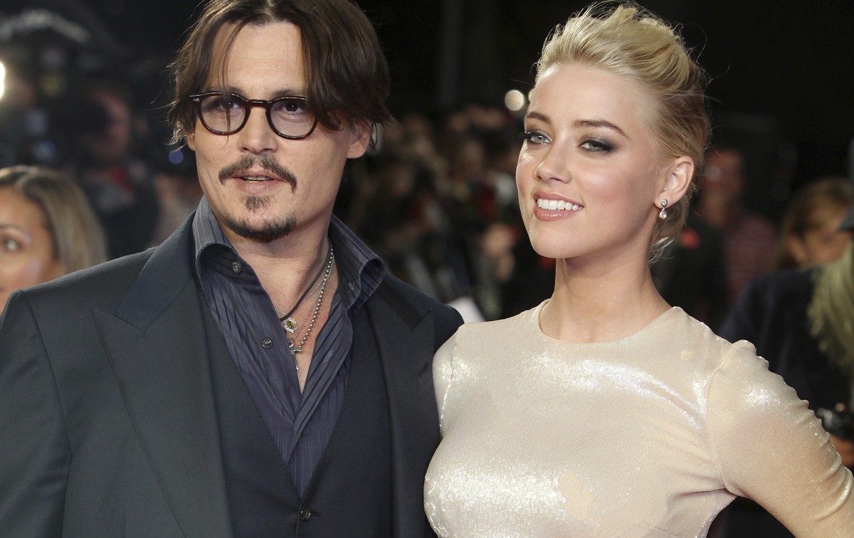 FILE - In this Nov. 3, 2011 file photo, U.S. actors Johnny Depp, left, and Amber Heard arrive for the European premiere of their film, "The Rum Diary," in London. A Los Angeles judge finaliz ...