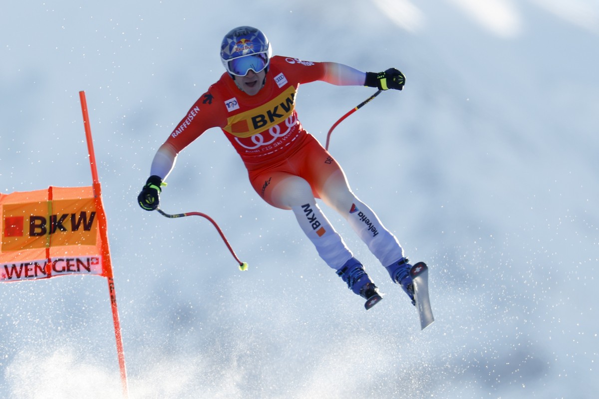 Switzerland's Marco Odermatt is airborne during an alpine ski, men's World Cup downhill race, in Wengen, Switzerland, Thursday, Jan. 11, 2024. (AP Photo/Alessandro Trovati)