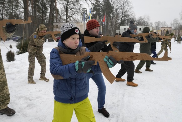 Yuri, 12, trains with members of Ukraine&#039;s Territorial Defense Forces, volunteer military units of the Armed Forces, close to Kyiv, Ukraine, Saturday, Feb. 5, 2022. Hundreds of civilians have bee ...