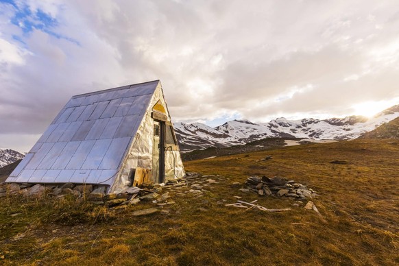 Thayer Hut, located in a remote area of the eastern Alaska Range beside Castner Glacier, has provided shelter for mountaineers and others since it was built in the 1960s Alaska, United States of Ameri ...