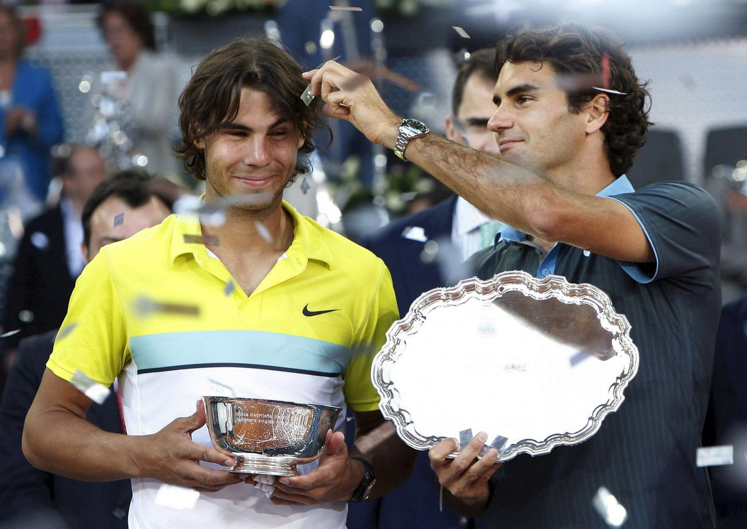 Swiss tennis player Roger Federer (R) and Spaniard Rafael Nadal pose with their trophies at the end of their Madrid Masters 1000 final match, at Magic Box pavilion, in Madrid, central Spain, 17 May 20 ...