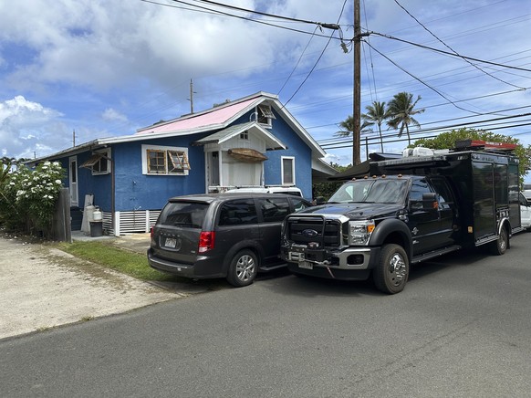 Investigator vehicles parked outside the Kaaawa, Hawaii home of Ryan Routh, the man accused of an apparent attempt to assassinate Donald Trump, on Tuesday, Sept. 17, 2024, while FBI agents conduct a s ...