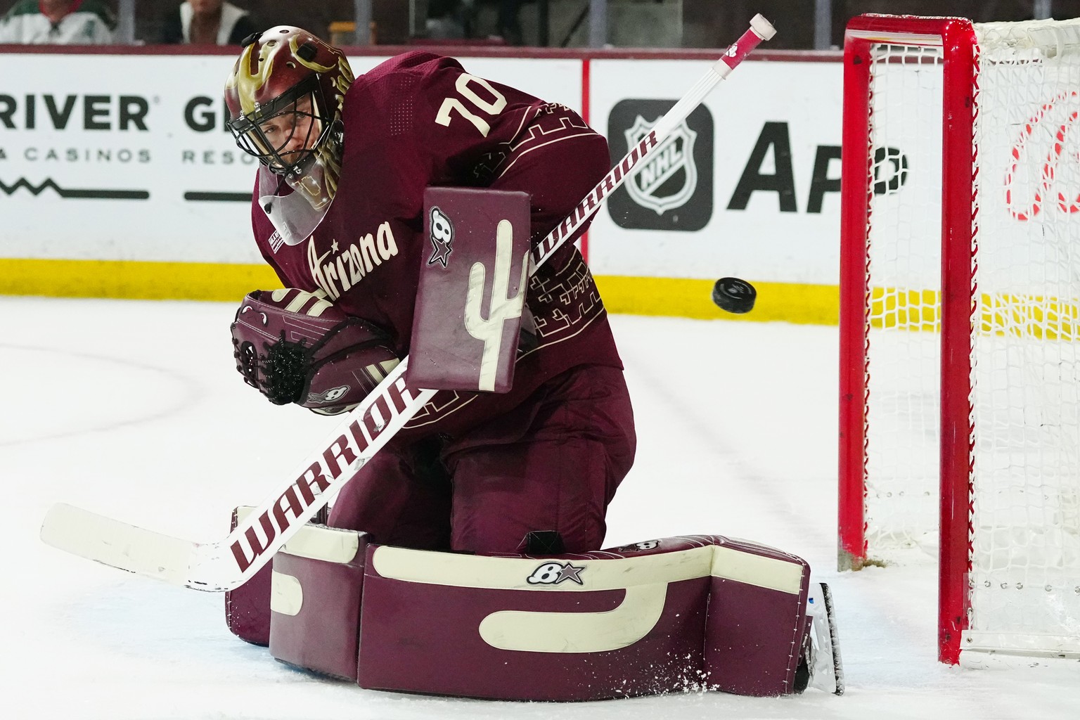 Arizona Coyotes goaltender Karel Vejmelka makes a save on a Dallas Stars shot during the second period of an NHL hockey game Friday, March 31, 2023, in Tempe, Ariz. (AP Photo/Ross D. Franklin)