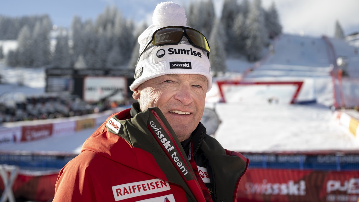 Hans Flatscher, left, Swiss-Ski Alpine director, takes a pose in the finish area prior to the second run of the men's Giant Slalom race at the Alpine Skiing FIS Ski World Cup, in Adelboden, Switz ...