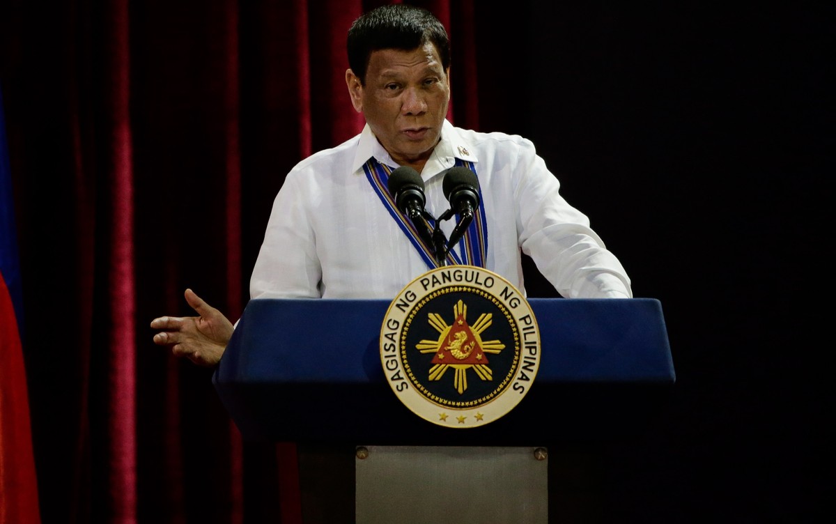 epa07243454 Philippine President Rodrigo Duterte gestures as he delivers a speech at the Philippine Air Force's change of command ceremony at the Villamor Airbase in Manila, Philippines, 21 Decem ...