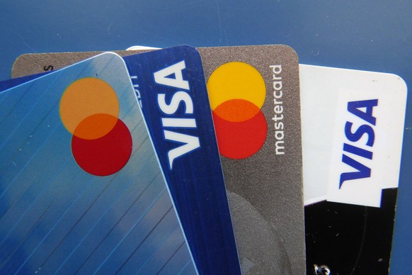 FILE - Credit cards as seen Thursday, July 1, 2021, in Orlando, Fla. After paying off credit card debt, it���s important to evaluate your relationship with plastic to determine whether a second chance ...