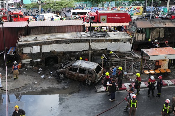 Rescuers work at a train crash site near an airport rail link station in Bangkok, Thailand, Saturday, May 16, 2026. (AP Photo/Sakchai Lalit)
Thailand Train Crash