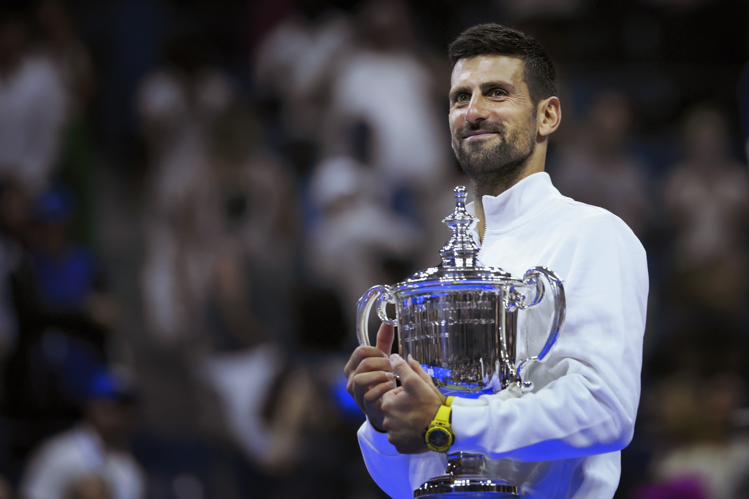 epa10853854 Novak Djokovic of Serbia celebrates with his trophy after he won against Daniil Medvedev of Russia in their Men&#039;s Final match at the US Open Tennis Championships at the Flushing Meado ...