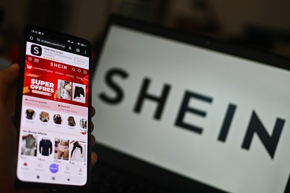 November 11, 2025, Clermont-Ferrand, Auvergne Rhone Alpes, France: Shein online store is shown on a phone screen, in Clermont-Ferrand, France, on November 11, 2025. The government still wants to get t ...