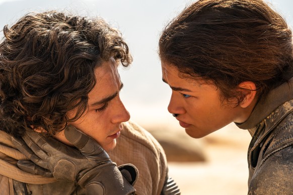 This image released by Warner Bros. Pictures shows Timothee Chalamet, left, and Zendaya in a scene from &quot;Dune: Part Two.&quot; (Niko Tavernise/Warner Bros. Pictures via AP)