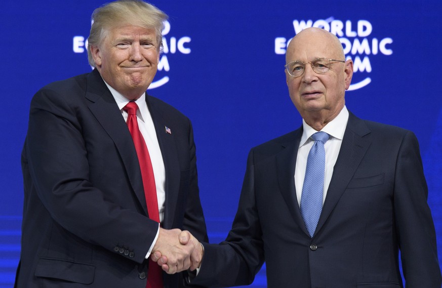 Donald Trump, President of the United States of America, left, shakes hands with German Klaus Schwab, Founder and Executive Chairman of the World Economic Forum, WEF the last day of the 48th Annual Me ...