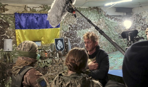 Hollywood actor and producer Sean Penn speaks with servicemen of the Ukrainian Armed Forces at their position near the frontline with Russia-backed separatists in Donetsk region, Ukraine, Thursday, No ...