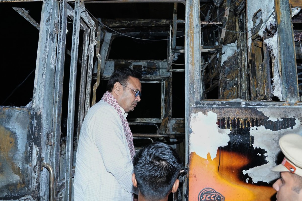 This photograph shared by Indian State Rajasthan Chief Minister's office shows Chief Minister Bhajan Lal Sharma inspecting a charred passenger bus after a suspected short circuit sparked a deadly ...