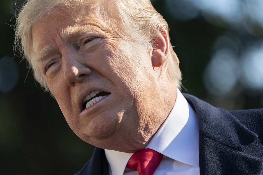 epa07265578 US President Donald J. Trump speaks to the media as he departs the White House on his way to Camp David, in Washington, DC, USA, 06 January 2019. EPA/CHRIS KLEPONIS / POOL