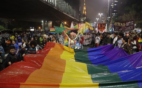 Demonstrators protest the decision of a Brazilian federal judge that psychologists could use sexual orientation conversion therapies in Sao Paulo, Brazil, Friday, Sept. 29, 2017. The professional coun ...