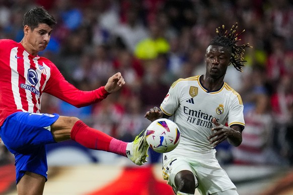 Atletico Madrid&#039;s Alvaro Morata, left, vies for the ball with Real Madrid&#039;s Eduardo Camavinga during the Spanish La Liga soccer match between Atletico Madrid and Real Madrid at Metropolitan  ...