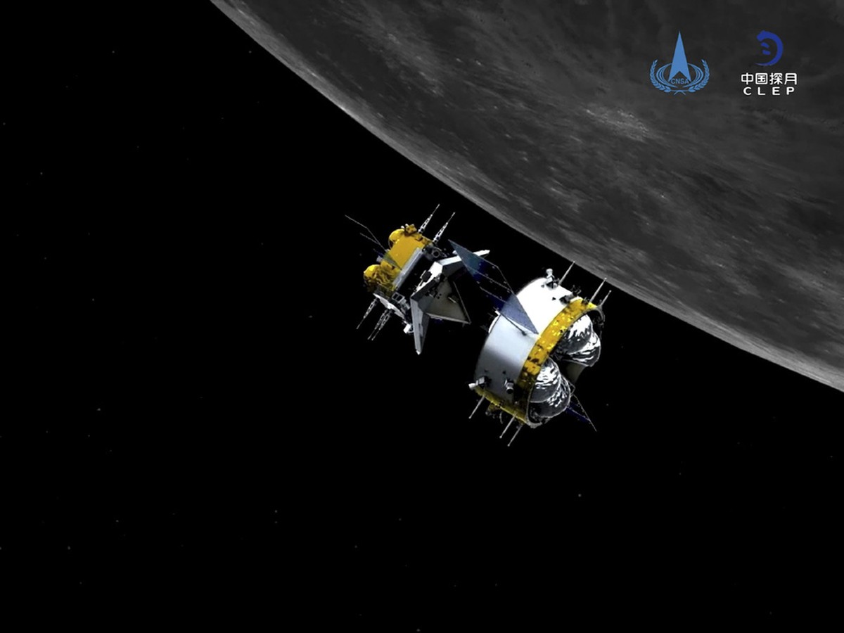 Die Illustration der China National Space Administration zeigt Chinas "Chang'e-5"-Kapsel, wie sie heute Abend auf der Erde landen soll. Ihre Bergung ist wegen ihre geringen Gr�sse, der  ...
