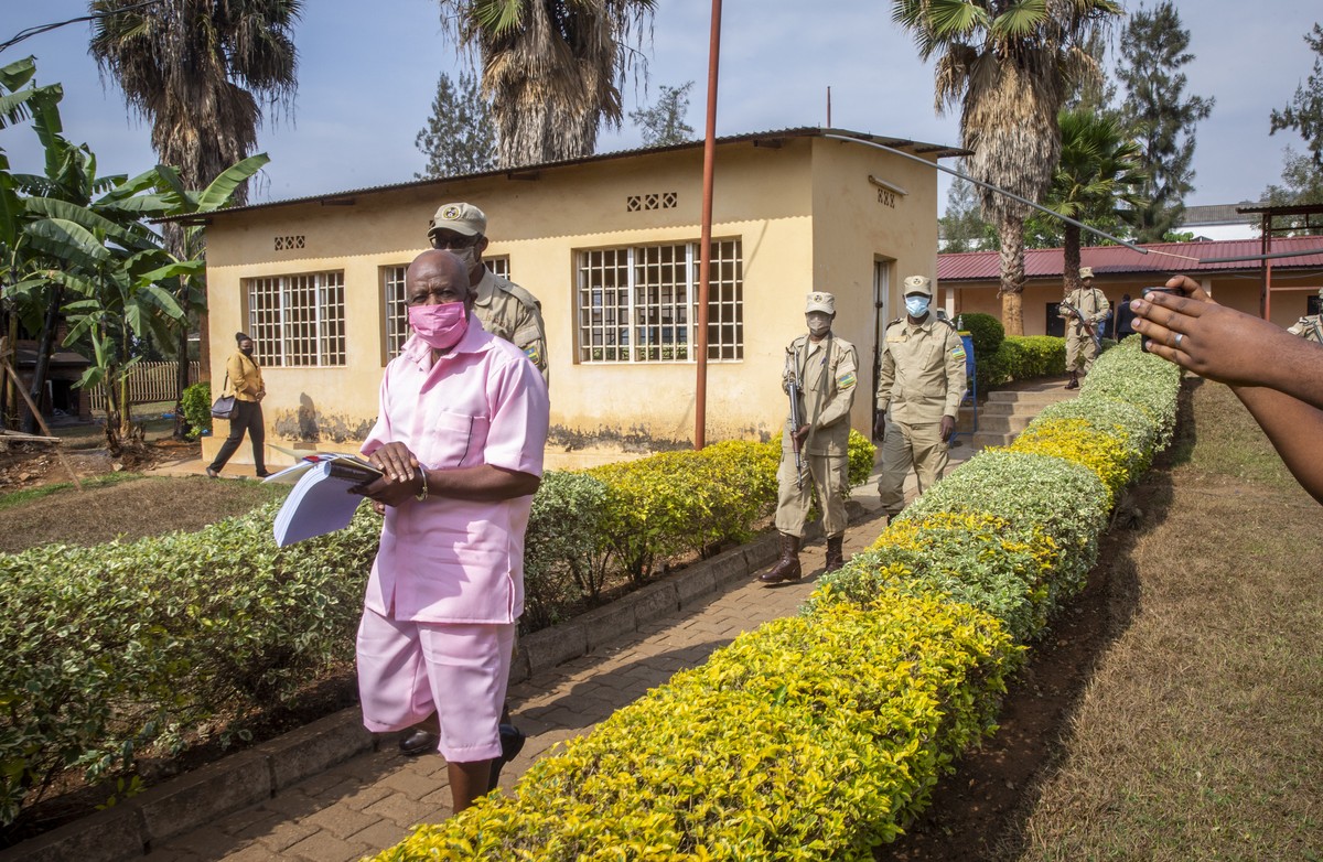 Paul Rusesabagina, whose story inspired the film "Hotel Rwanda", wears a pink prison uniform as he arrives for a bail hearing at a court in the capital Kigali, Rwanda Friday, Sept. 25, 2020. ...