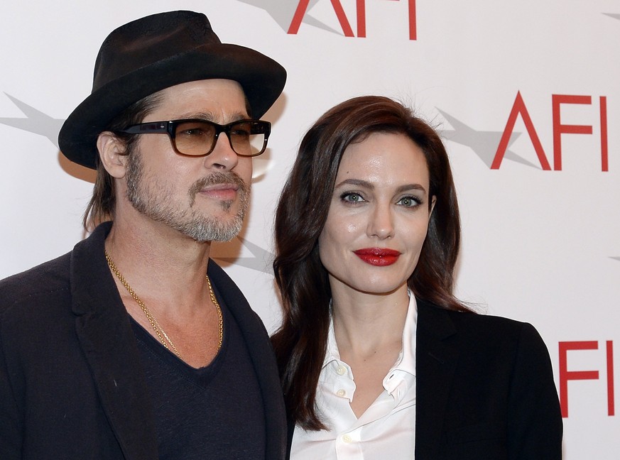 Actor Brad Pitt and actress/director Angelina Jolie pose at the AFI Awards 2014 honoring excellence in film and television in Beverly Hills, California, U.S. on January 9, 2015. REUTERS/Kevork Djansez ...