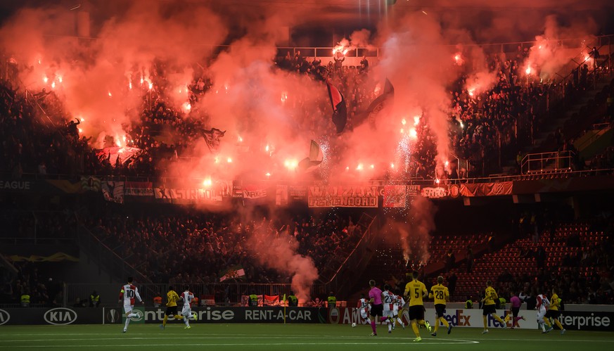 Fans of Feyernoord Rotterdam pictured with pyrotechnic devices, during the UEFA Europa League group stage group G soccer match between Switzerland&#039;s BSC Young Boys Bern and Nederland&#039;s Feyer ...