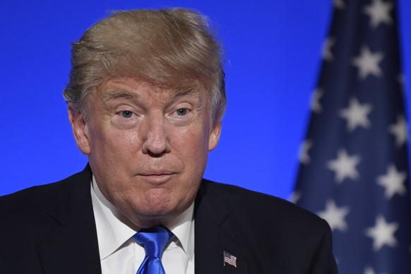 epa06085689 US President Donald J. Trump speaks at a joint news conference at the Elysee Palace in Paris, 13 July 2017. US President Trump earlier arrived for an official visit to Paris. EPA/JULIEN DE ...