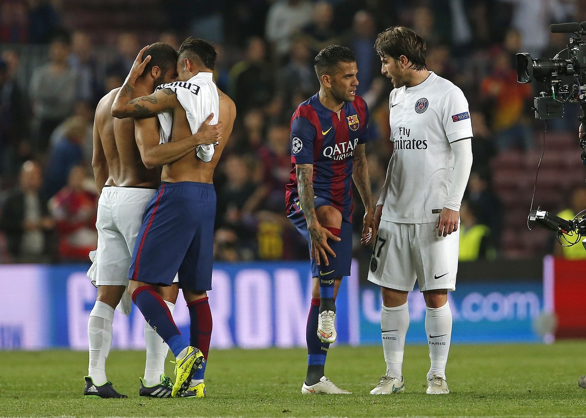 Barcelona's Neymar, second left and Dani Alves, greet PSG's Lucas, left, and Maxwell, right, after the Champions League quarterfinal second leg soccer match between FC Barcelona and Paris Sa ...
