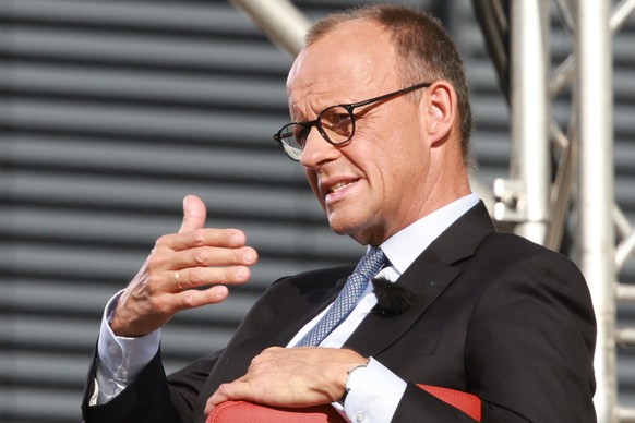 epa12235960 German Chancellor Friedrich Merz gestures in an interview situation after the summer interview with public broadcaster ARD in Berlin, Germany, 13 July 2025. EPA/CLEMENS BILAN
