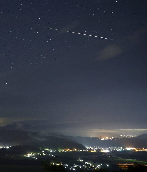Perseid meteor shower A shooting star lights up the night sky in Ojiya in Niigata Prefecture, northwest of Tokyo, on Aug. 14, 2023, as the annual summer Perseid meteor shower peaks. PUBLICATIONxINxAUT ...