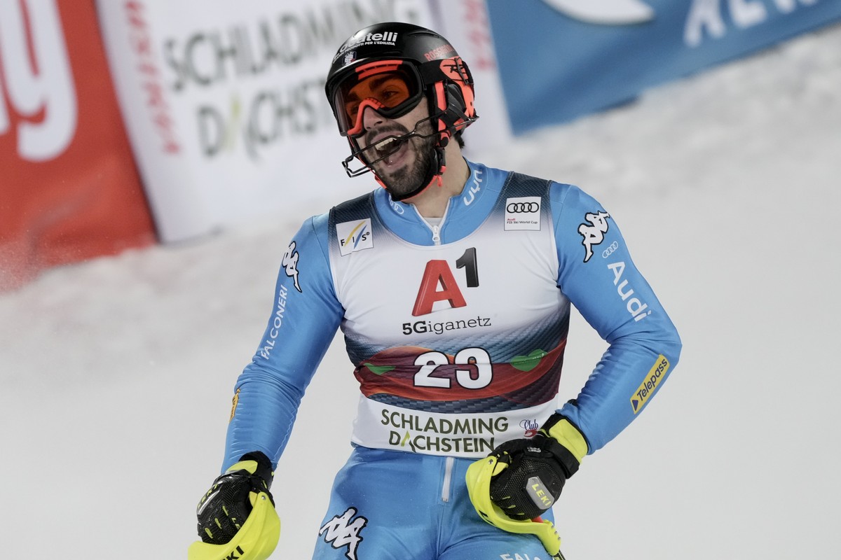 Italy's Tommaso Sala reacts in the finish area after completing an alpine ski, men's World Cup slalom, in Schladming, Austria, Tuesday, Jan. 25, 2022. (AP Photo/Giovanni Auletta)